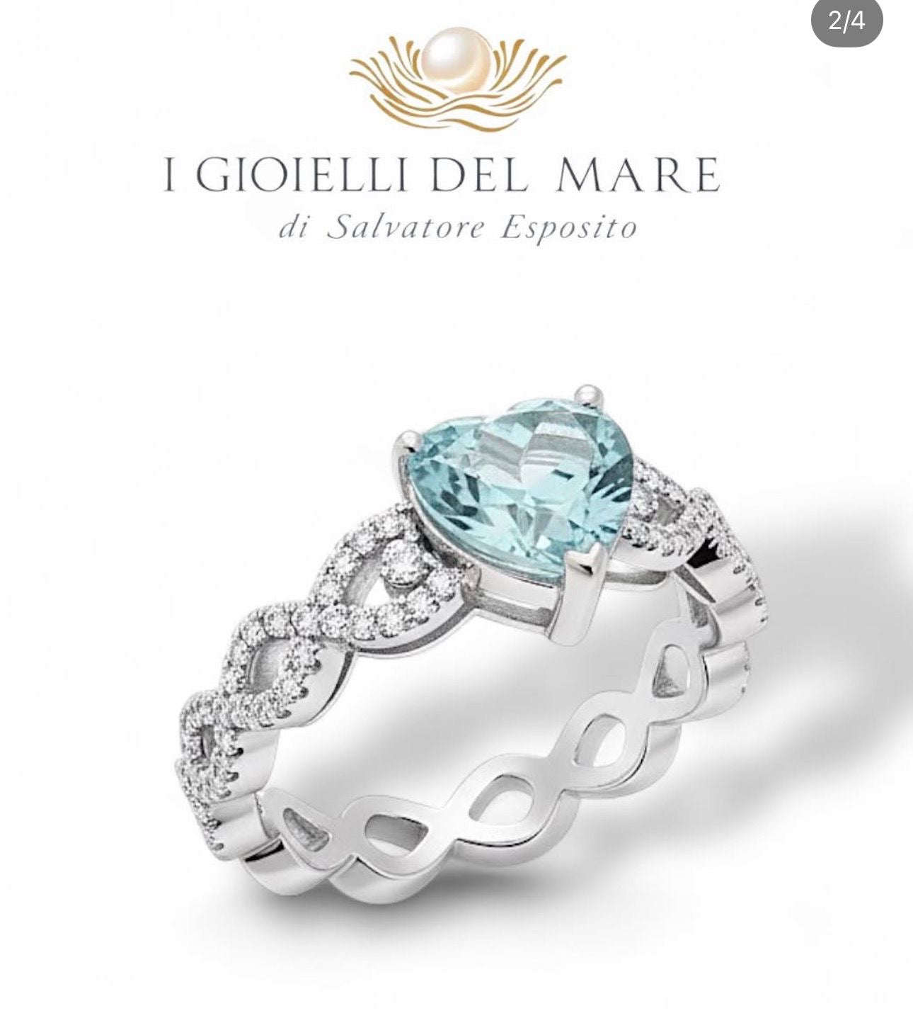 Anello in oro bianco con brillantini ed acquamarina a cuore (Info su richiesta)