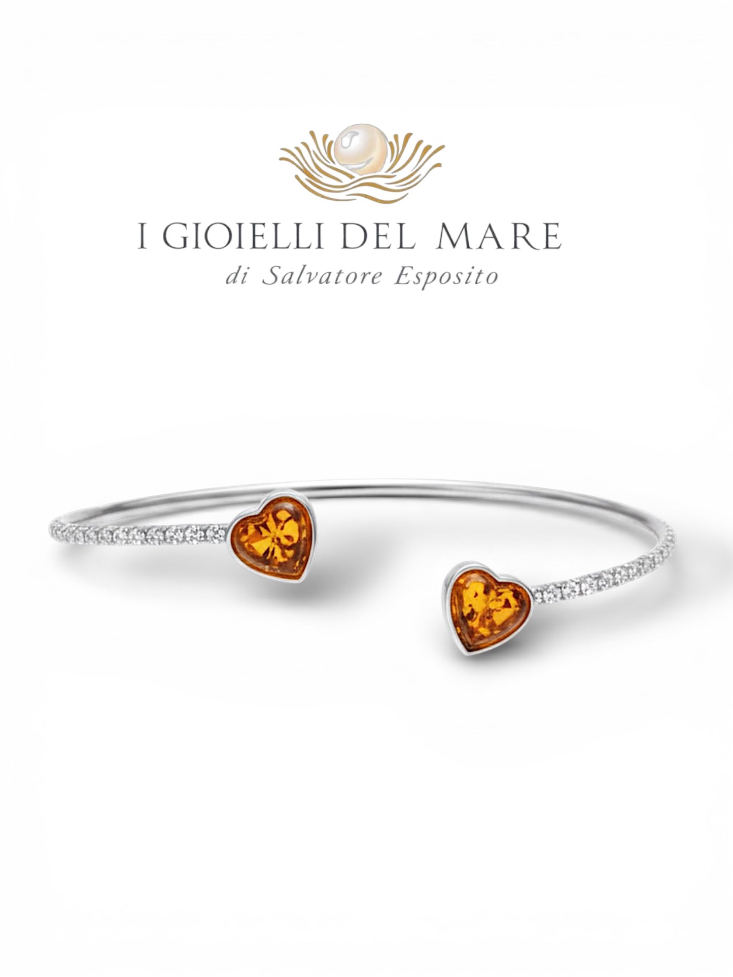 Bracciale in oro bianco e brillanti con cuori in ambra (Info su richiesta)