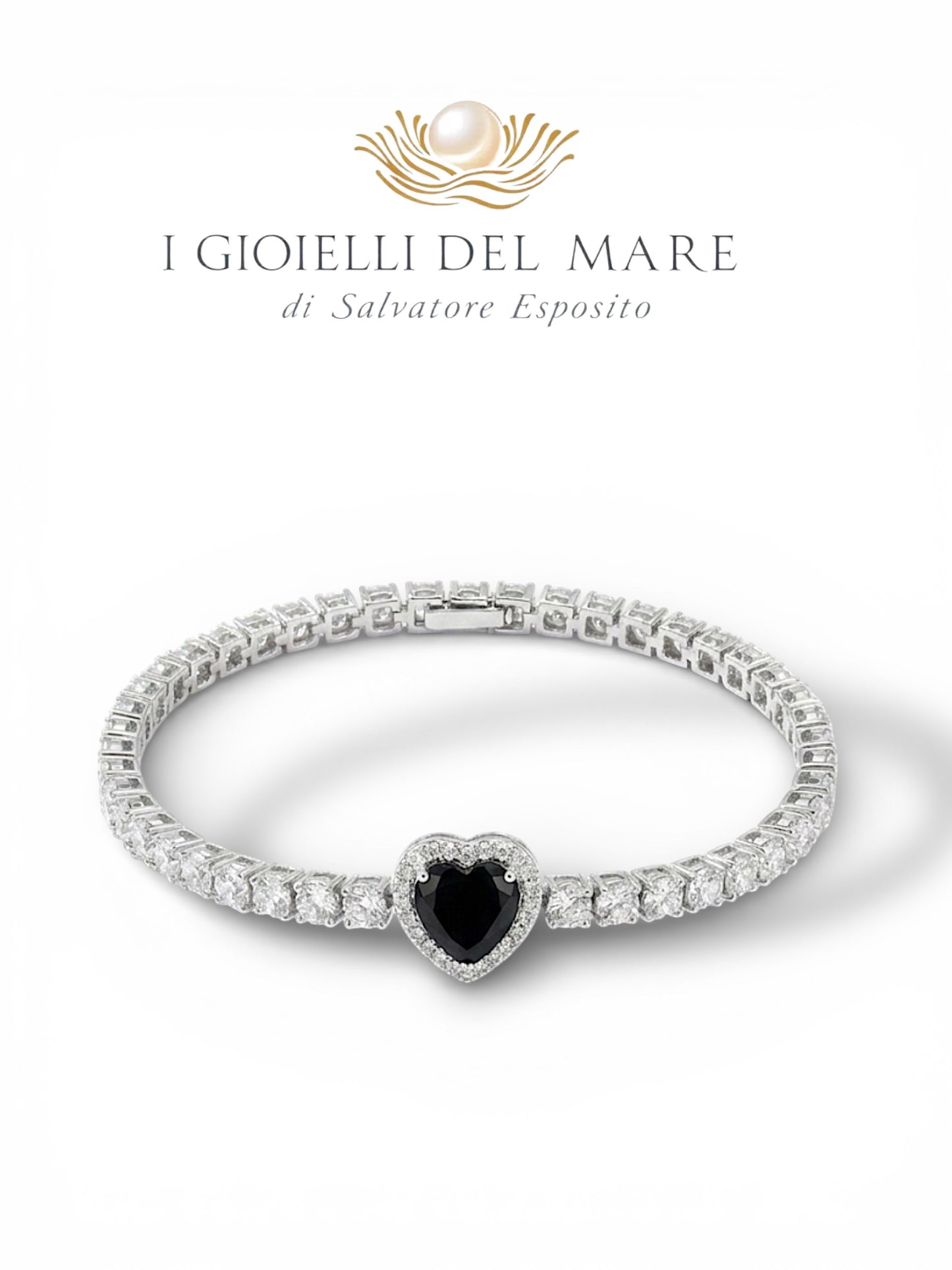 Bracciale tennis in oro bianco e brillanti con diamante nero a cuore (Info su richiesta)