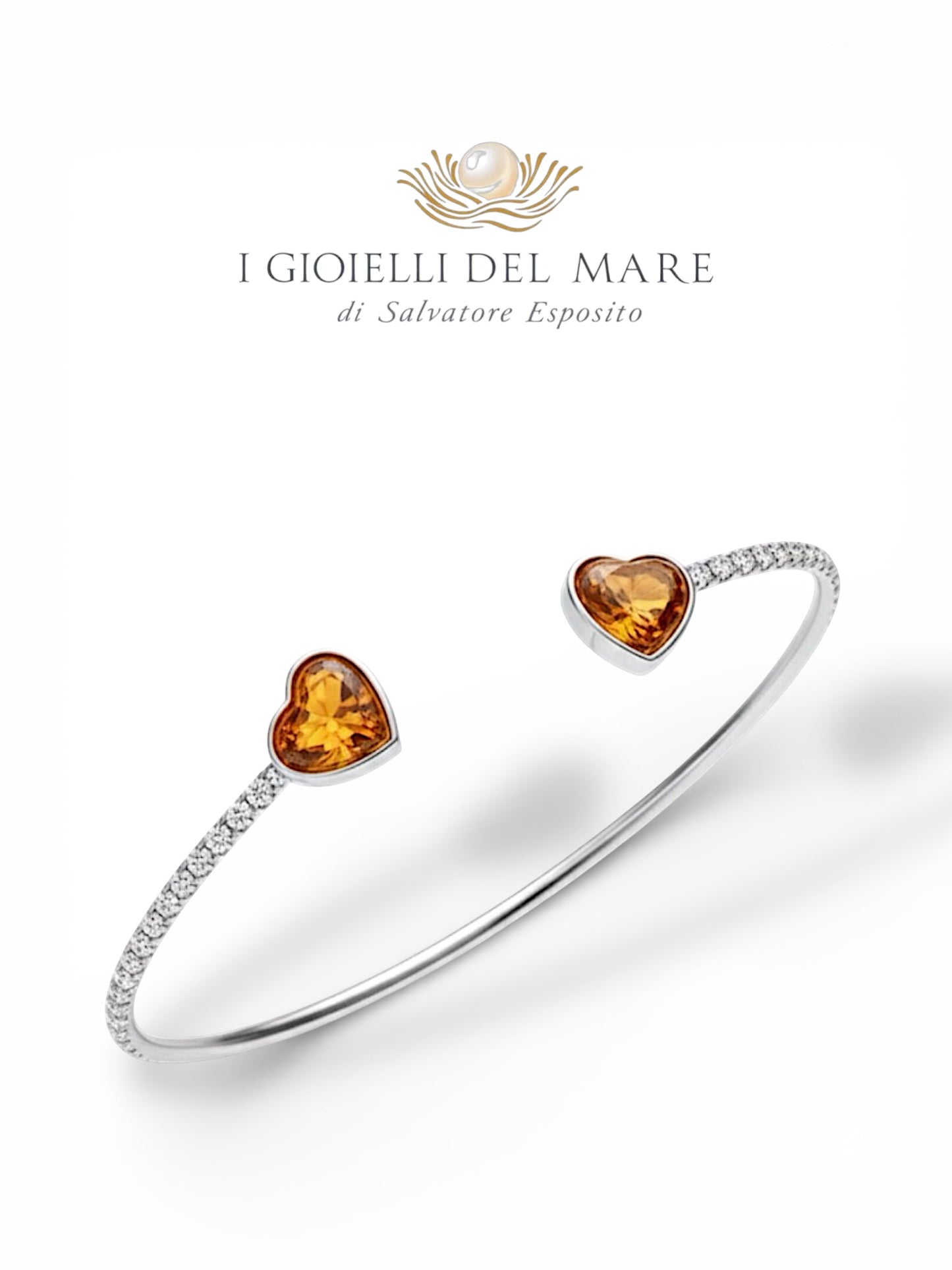 Bracciale in oro bianco e brillanti con cuori in ambra (Info su richiesta)