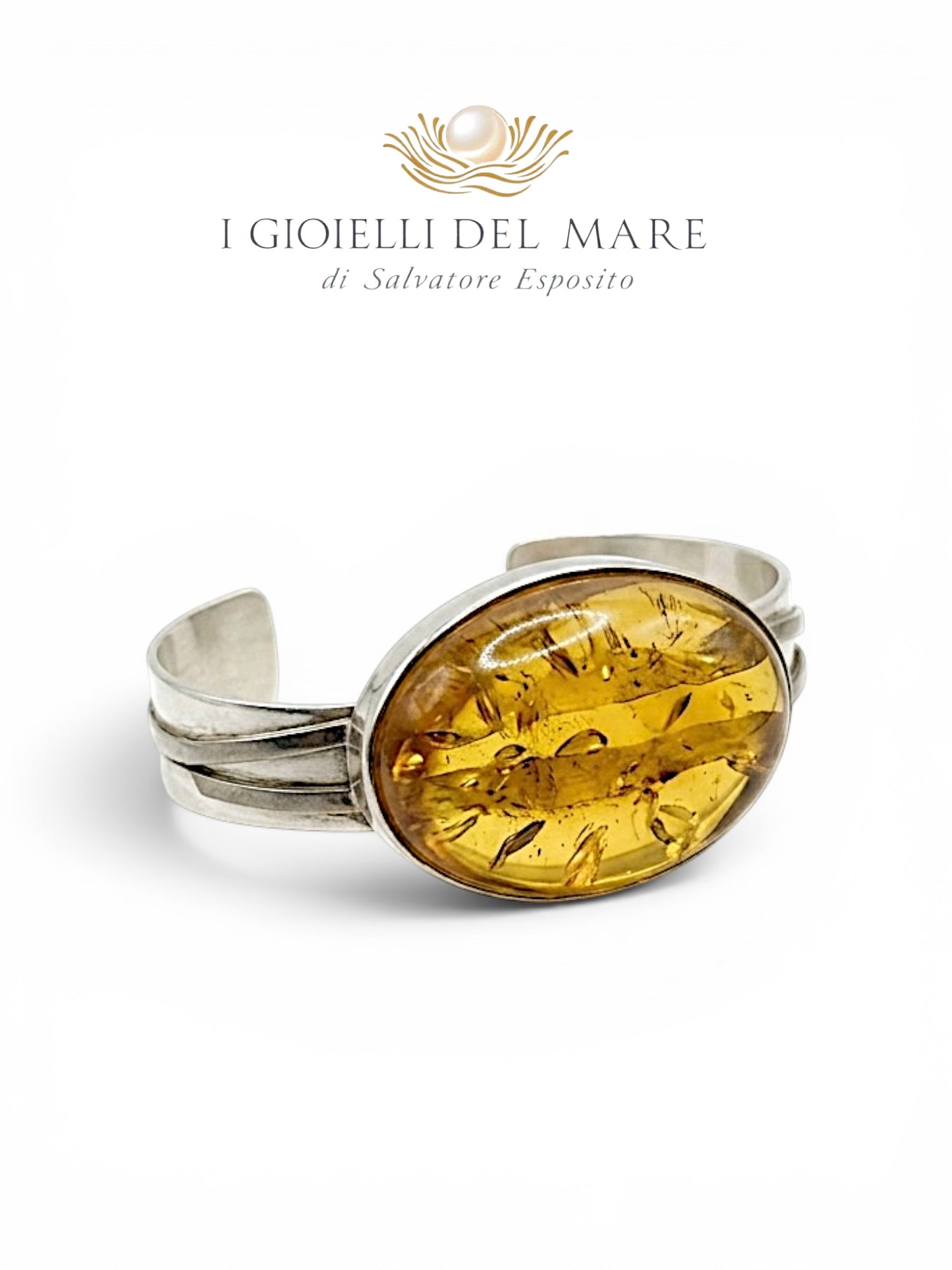 Bracciale rigido artigianale in argento con cabochon in ambra baltica - vista frontale
